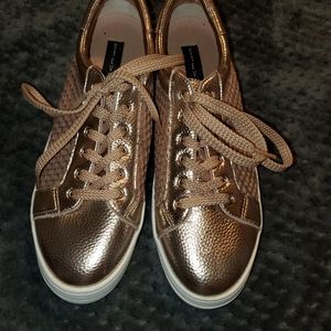 Steven by Steve Madden rose gold sneakers.